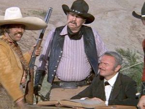 The Bandit needs no stinkin' badges. Along with Slim Pickins and Harvey Korman, we see villainry in western parody.   