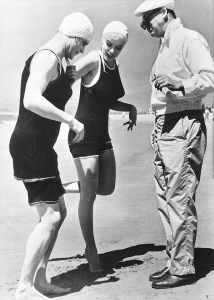 Jack Lemmon and Marilyn Monroe get direction from Billy Wilder- in matching swimsuits 