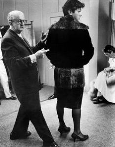 Wardrobe also played a key role in convincing cross-dressing. Here famous designer Orry-Kelly checks details and fit. 