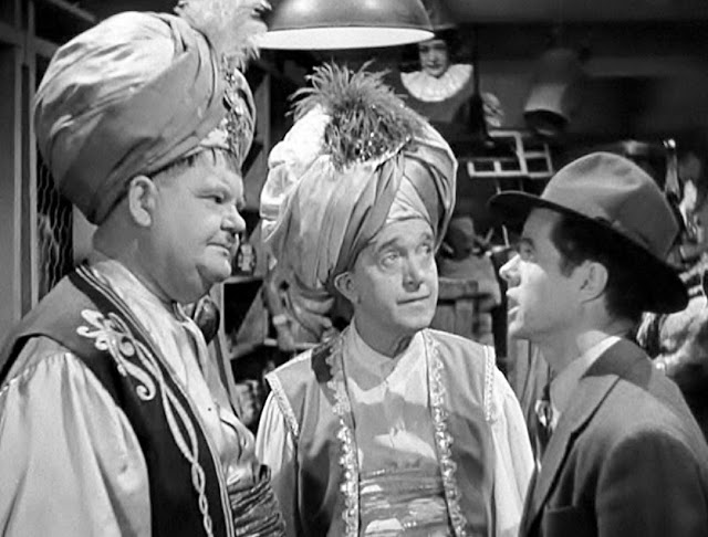 Stan-Laurel-Oliver-Hardy-and-Elisha-Cook-Jr.-in-A-Haunting-We-Will-Go-1942
